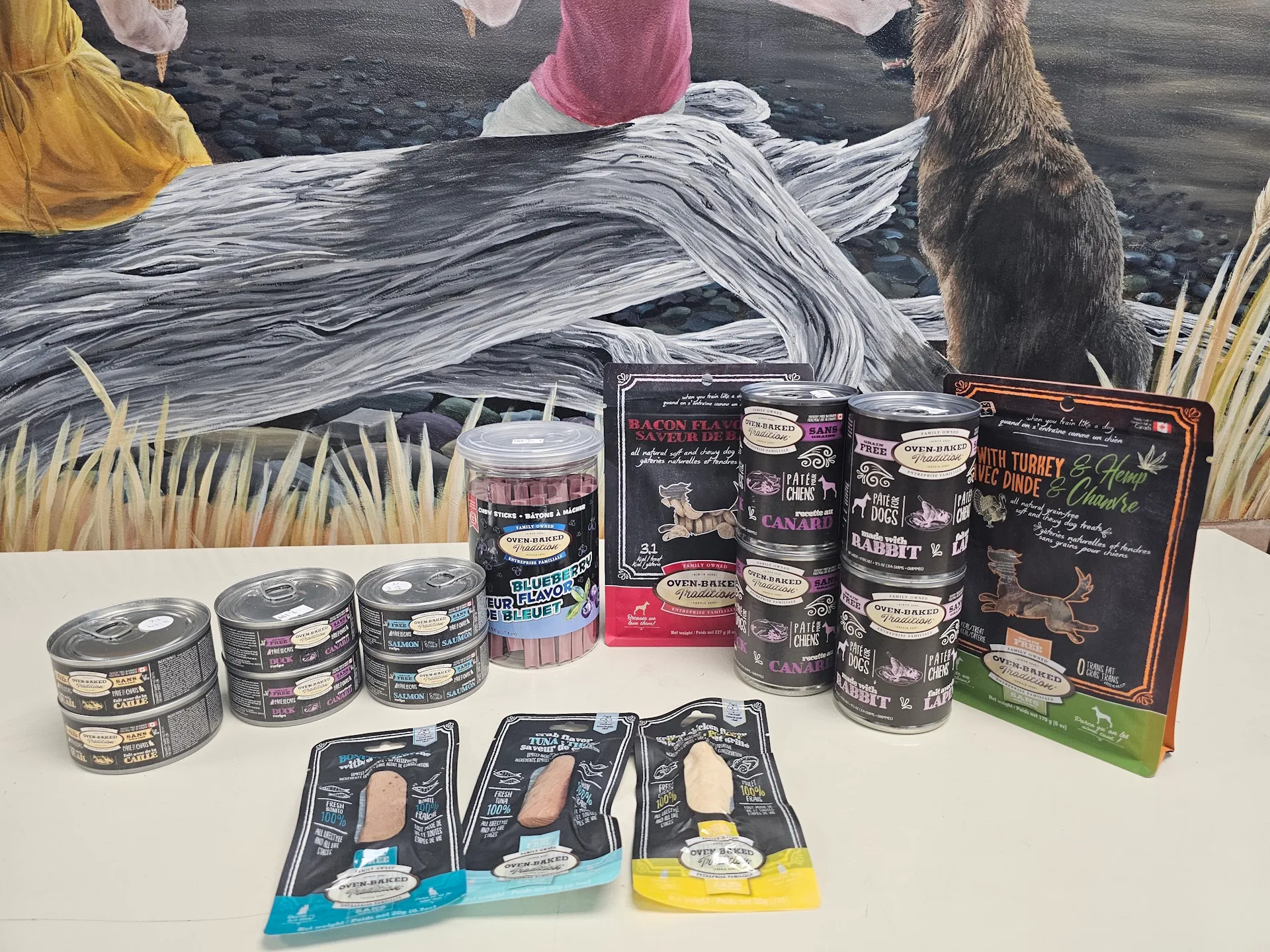 Colorful assortment of Oven Baked Tradition treats on shelves at East Coast Pets