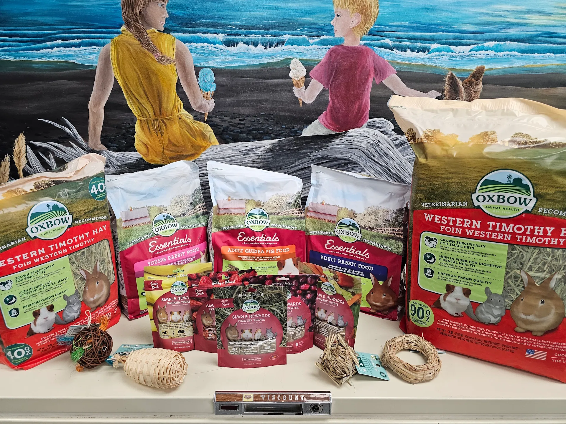 Colorful assortment of Oxbow products on shelves at East Coast Pets